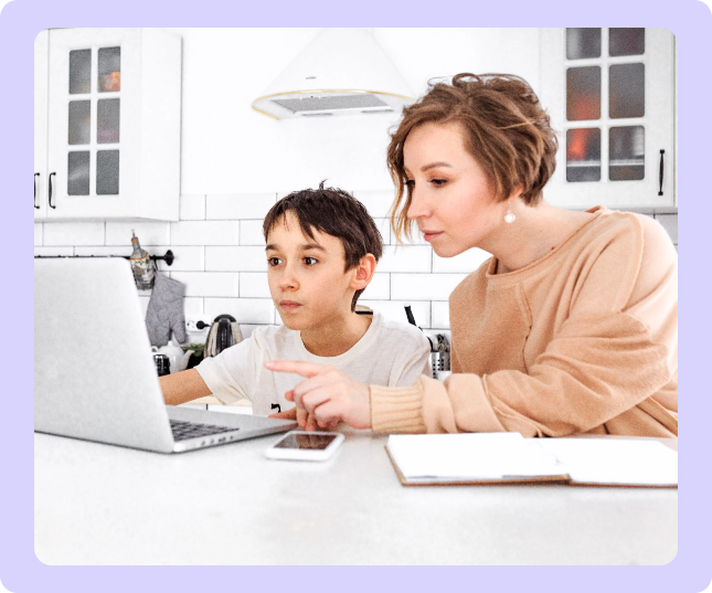 Parent helping a child with a laptop